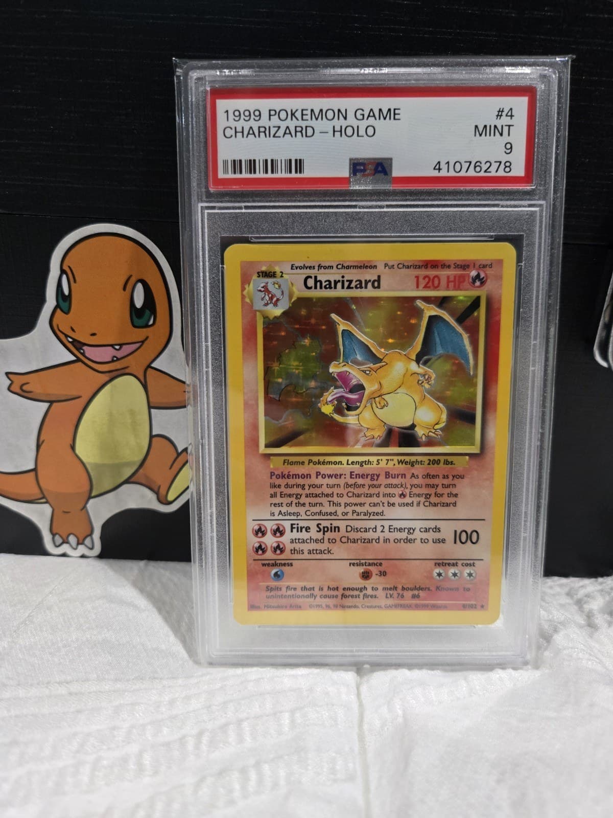 Front of a PSA-graded 1999 Base Set Charizard, 4 of 102, showing the red label and the grade of 9