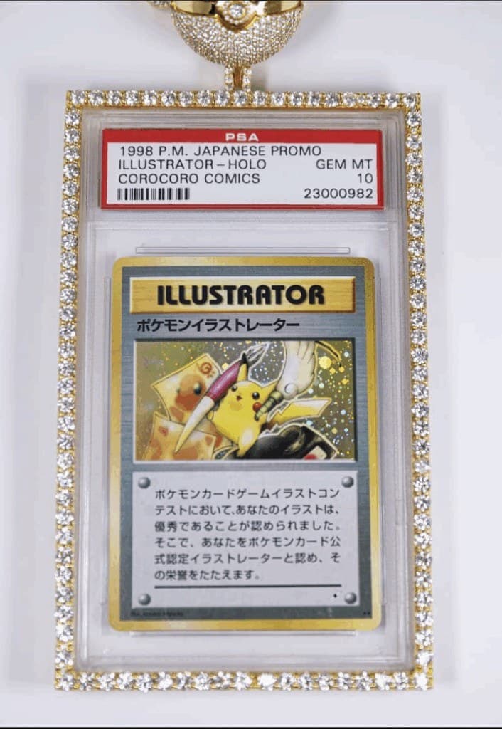 The 1998 Pokemon Illustrator promo card awarded in a CoroCoro art contest, in a PSA 10 holder set in a jewelled frame