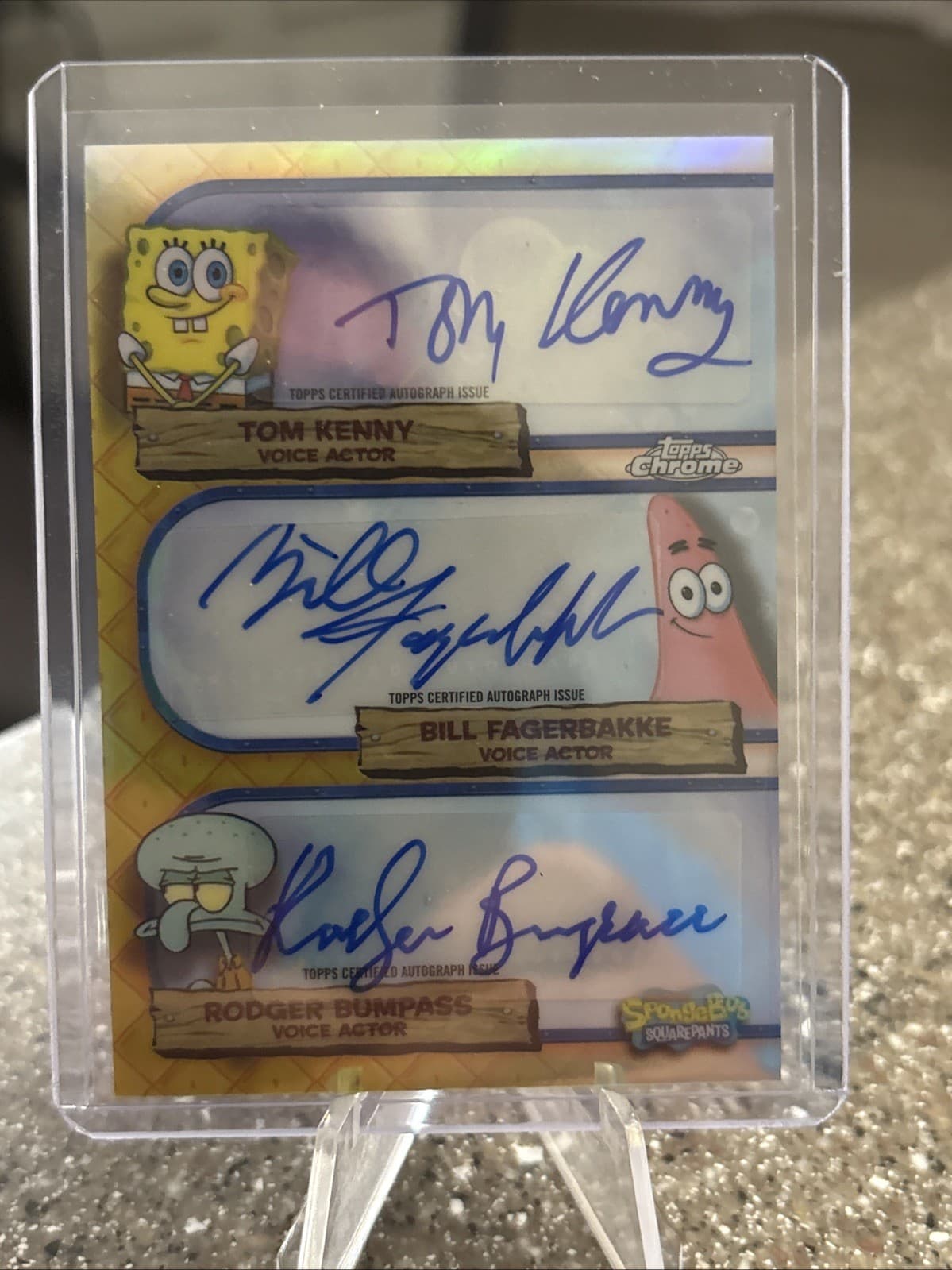 A 2025 Topps Chrome SpongeBob triple-autograph card, signed in blue by the three voice actors