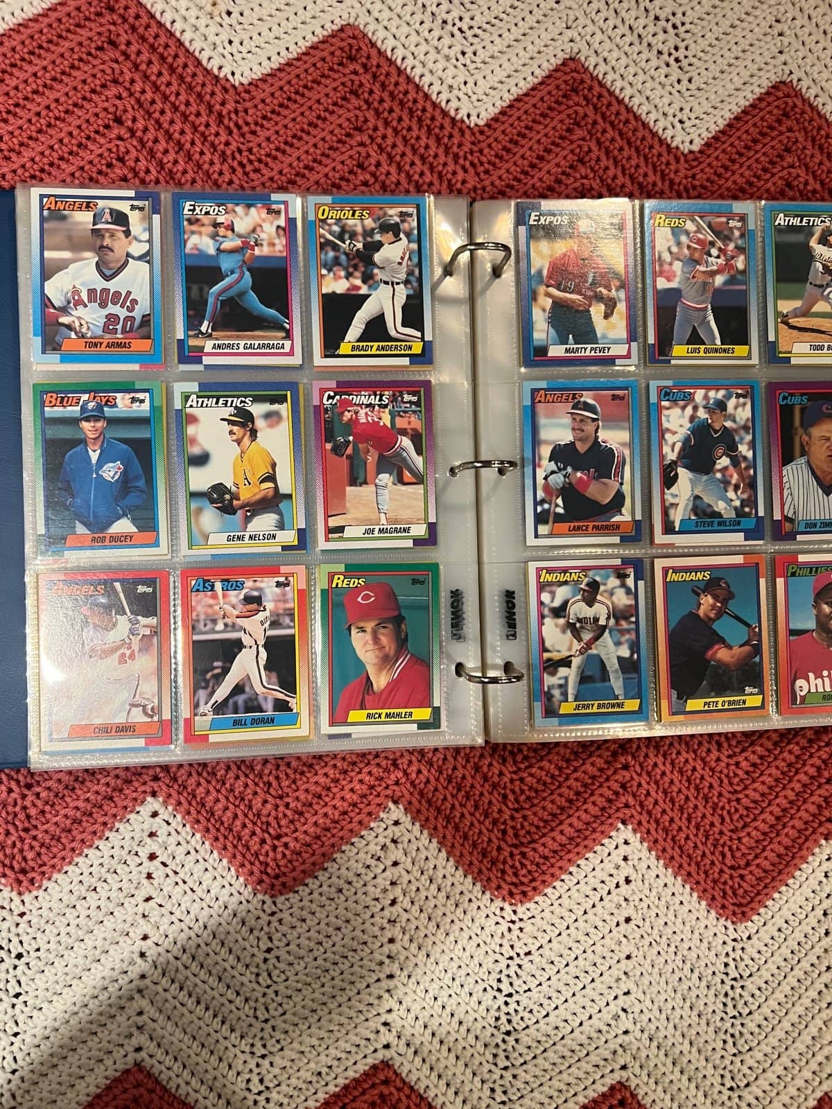 Nine-pocket binder pages filled with ordinary 1990s baseball base cards