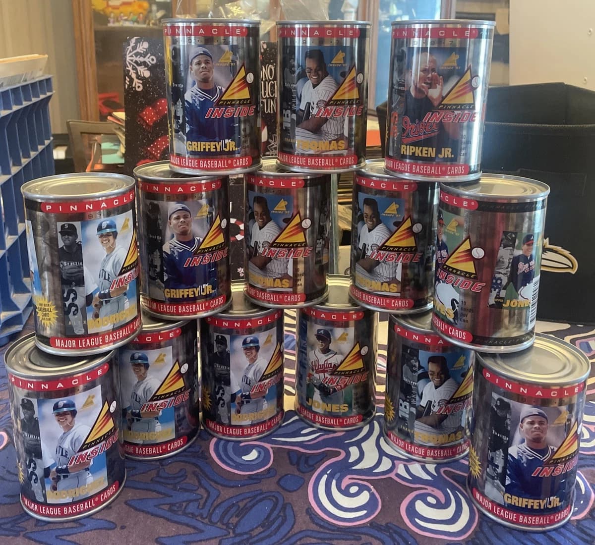 A stack of 1997 Pinnacle Inside baseball card cans featuring star players