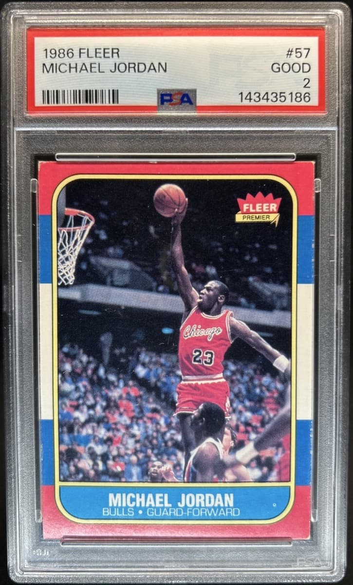 A 1986-87 Fleer Michael Jordan rookie card, number 57, in a PSA 2 slab