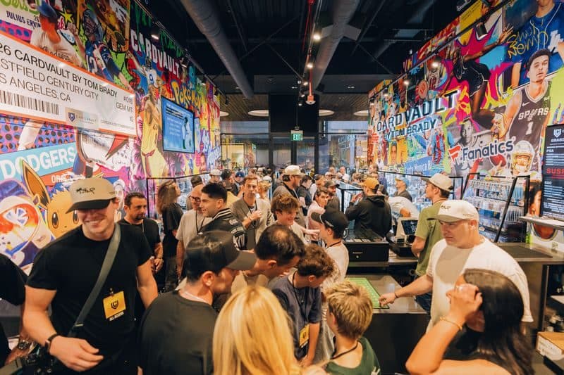 A crowd of collectors fills the aisles of the store under walls of sealed product