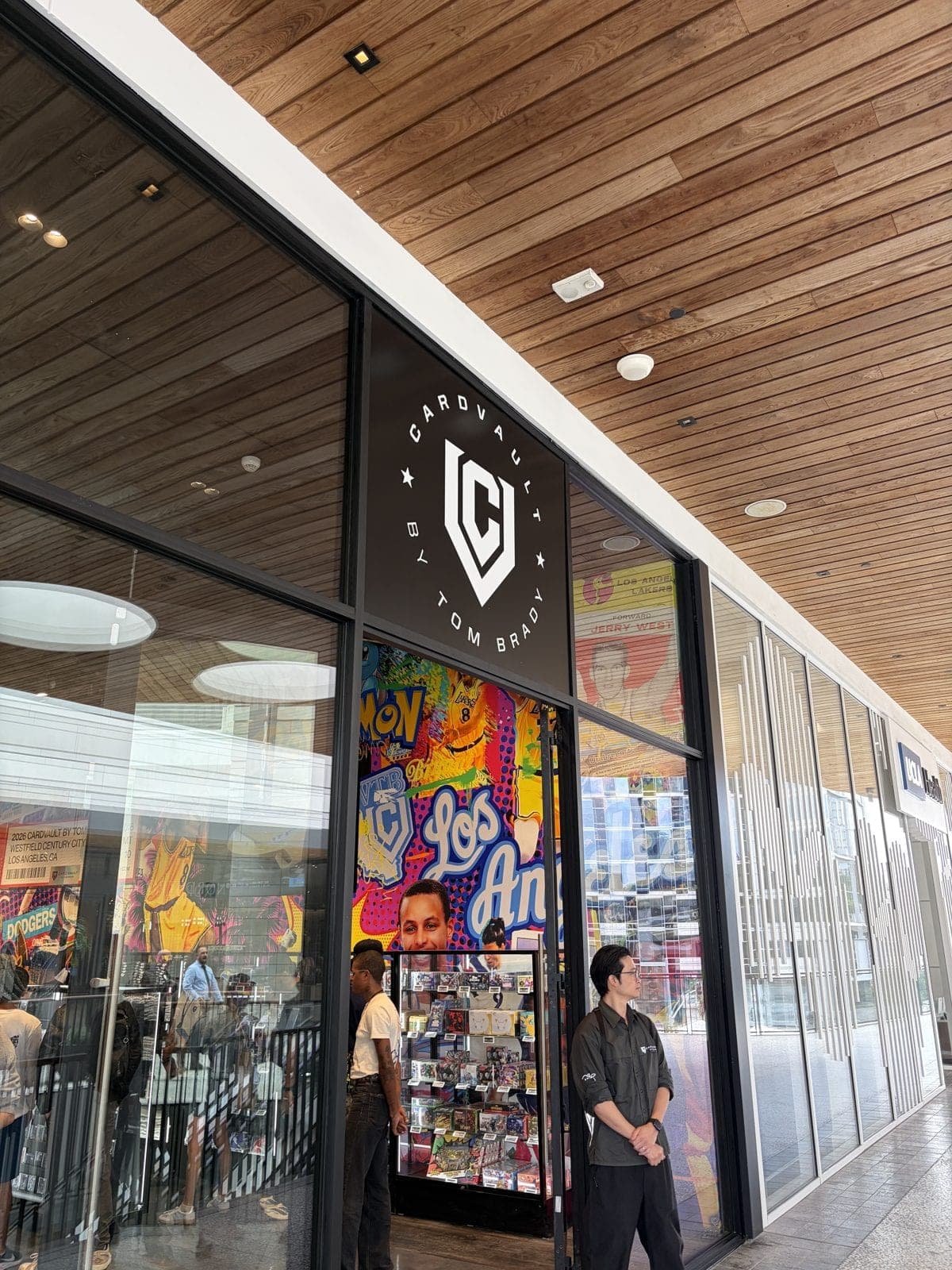 The CardVault by Tom Brady storefront at Westfield Century City on opening day, with a Los Angeles mural behind the glass