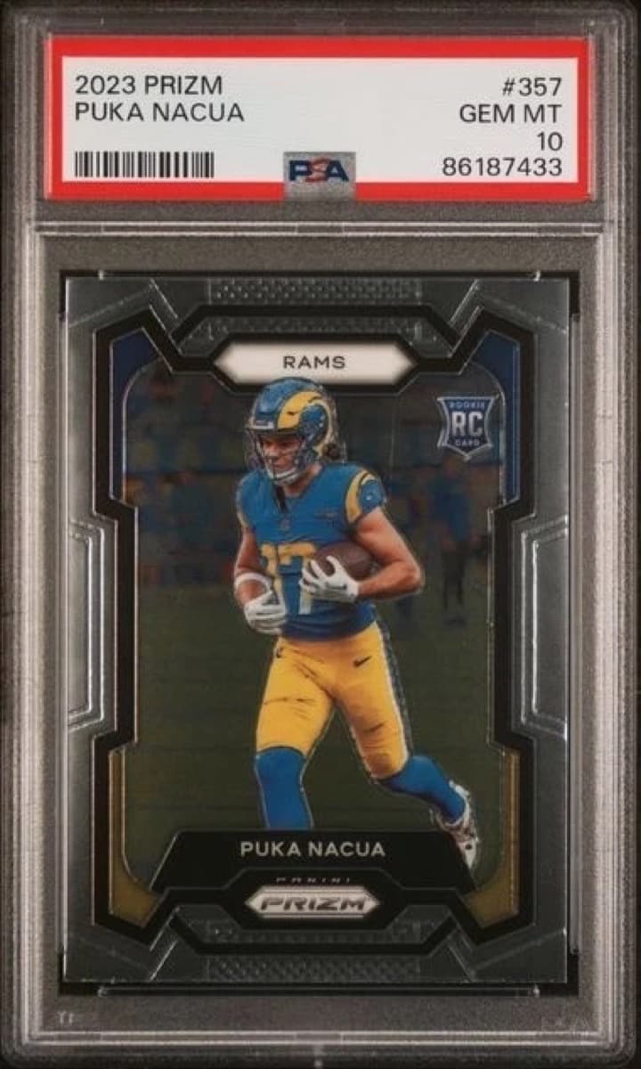 A 2023 Panini Prizm Puka Nacua rookie card, number 357, in a PSA 10 slab