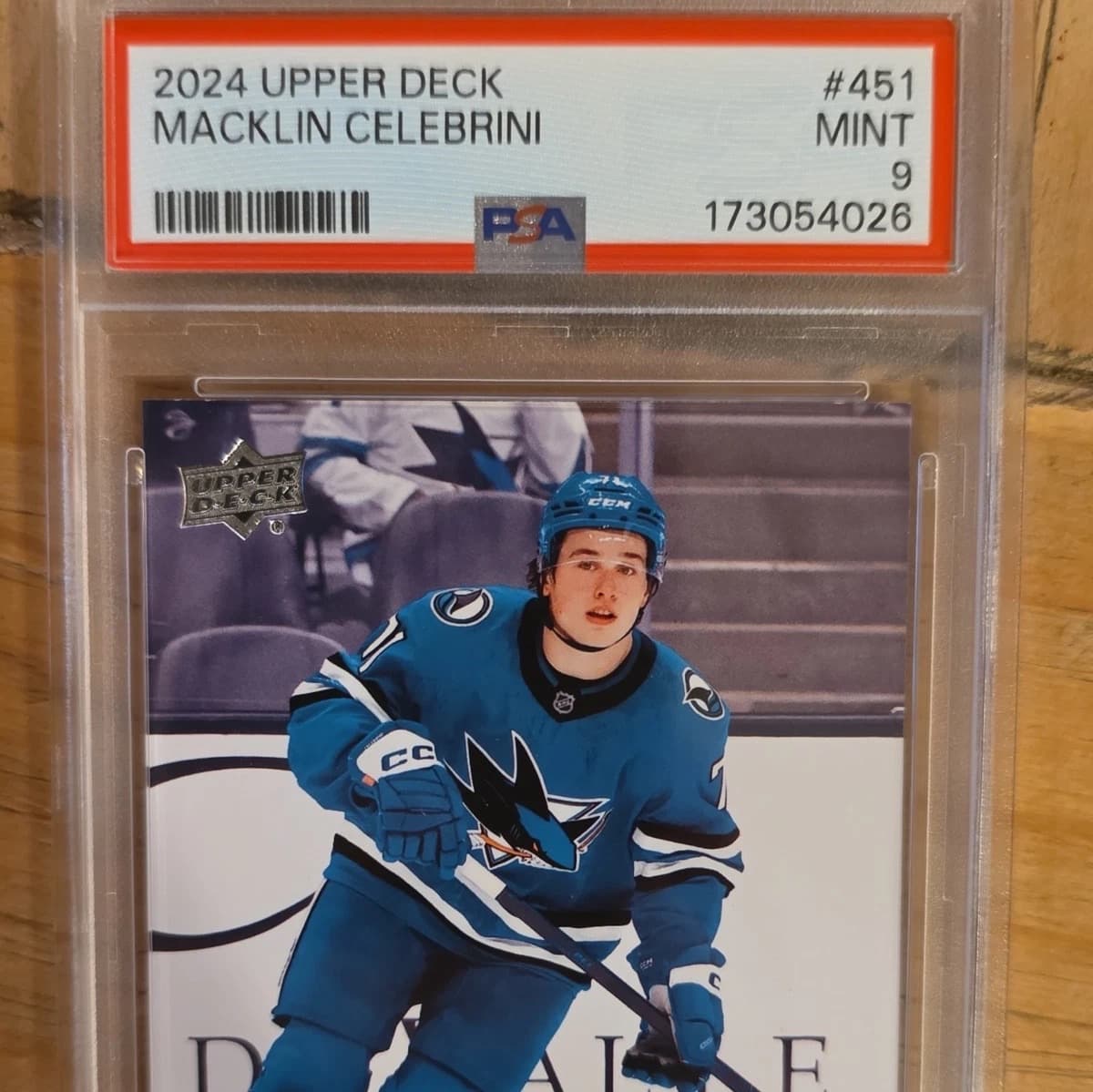 A 2024-25 Upper Deck Young Guns Macklin Celebrini rookie card, number 451, in a PSA 9 slab