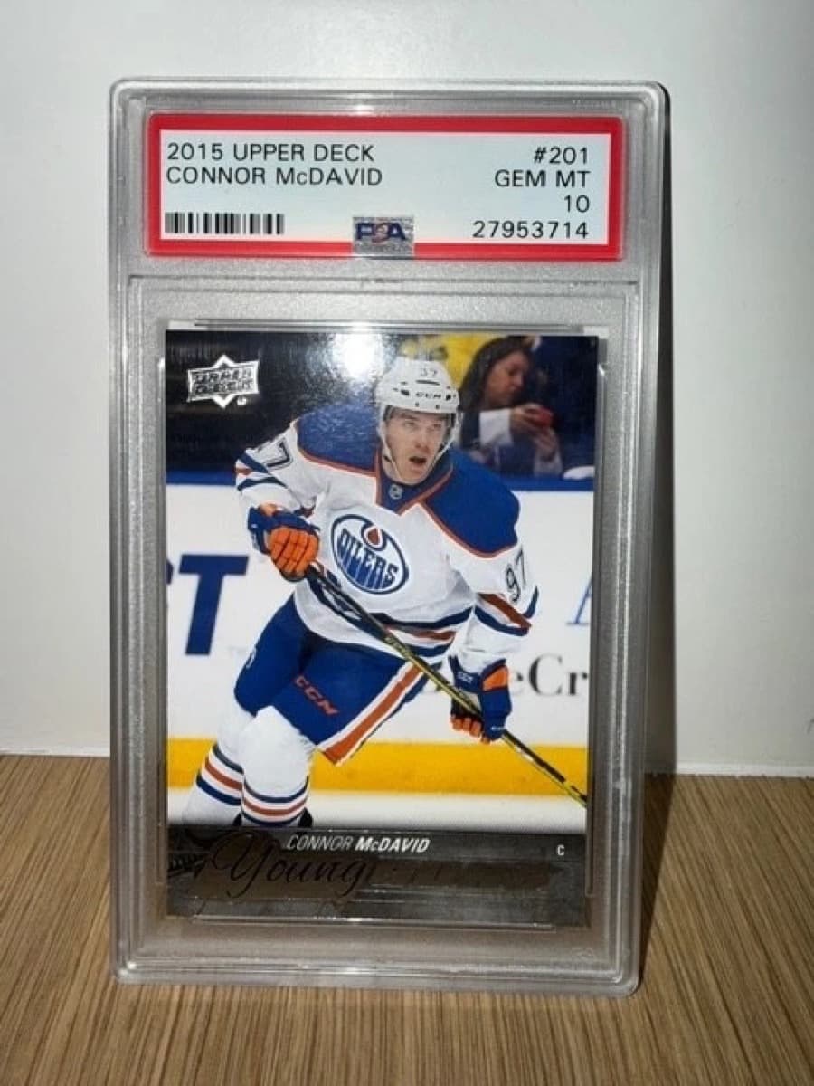 A 2015-16 Upper Deck Young Guns Connor McDavid rookie card, number 201, in a PSA 10 slab