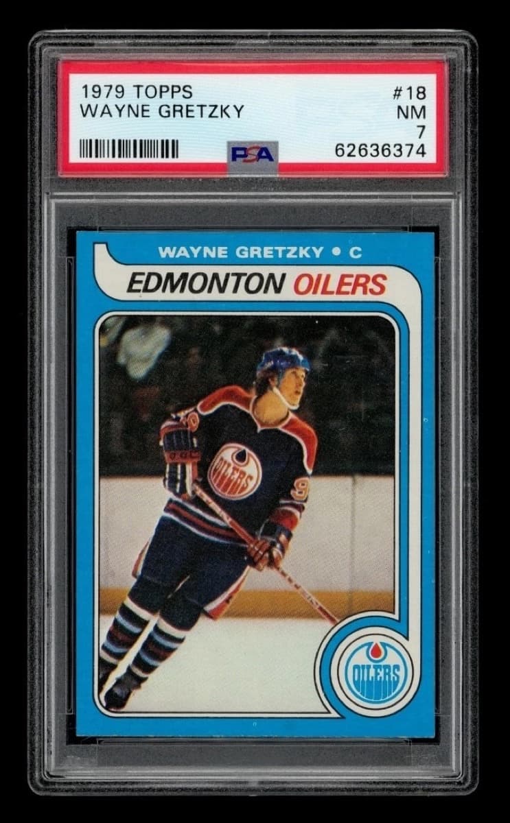 A 1979-80 Topps Wayne Gretzky rookie card, number 18, in a PSA 7 slab