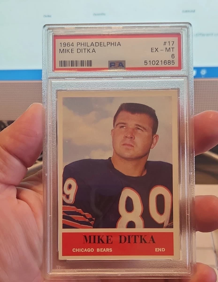 A 1964 Philadelphia Mike Ditka card, number 17, in a PSA 6 slab