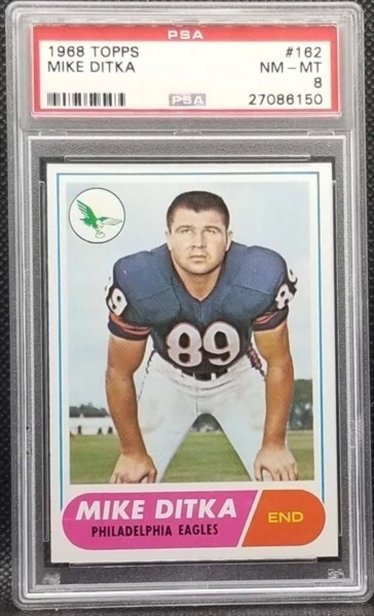 A 1968 Topps Mike Ditka card, number 162, in a PSA 8 slab