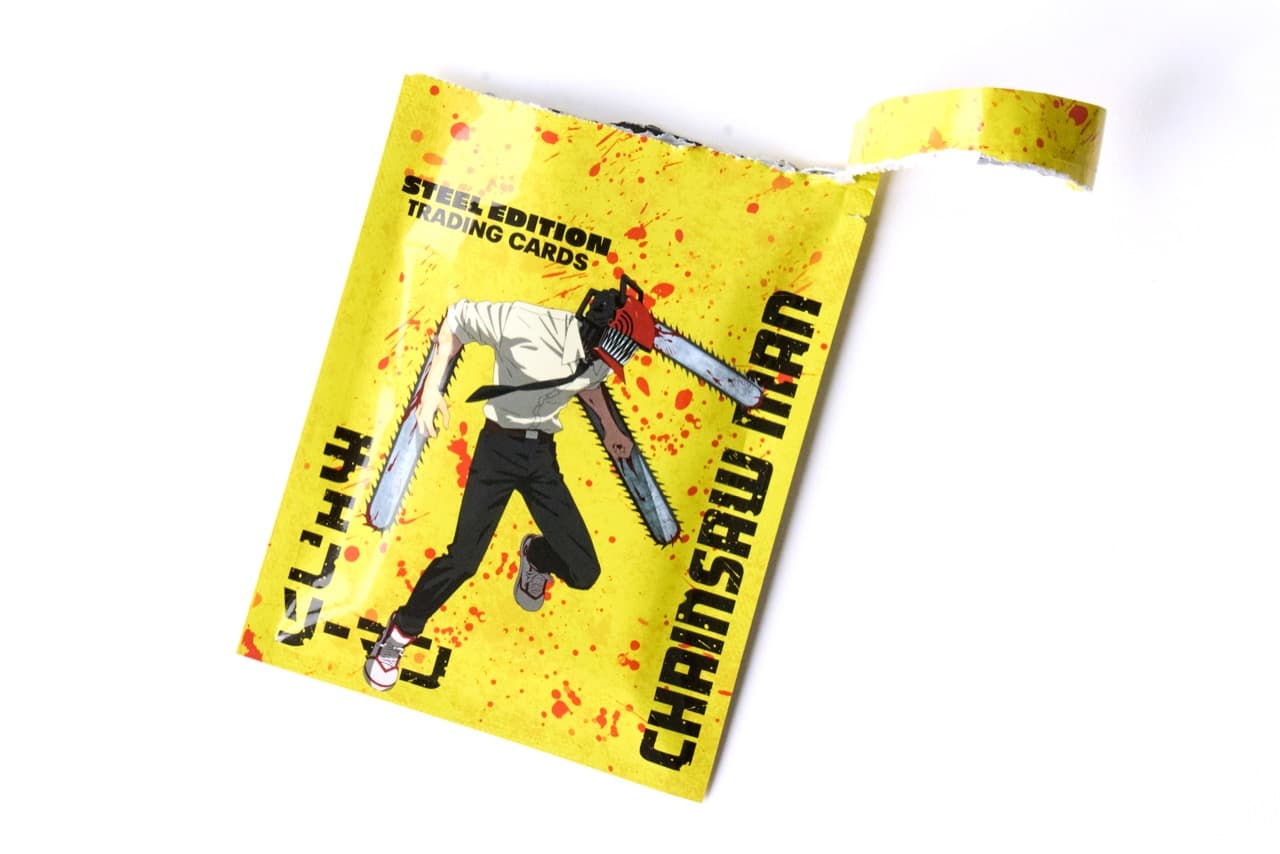 An opened yellow Chainsaw Man Steel Edition Trading Cards pack