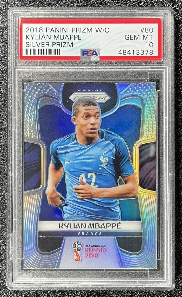 A 2018 Panini Prizm World Cup Silver Kylian Mbappé rookie card, number 80, in a PSA 10 slab