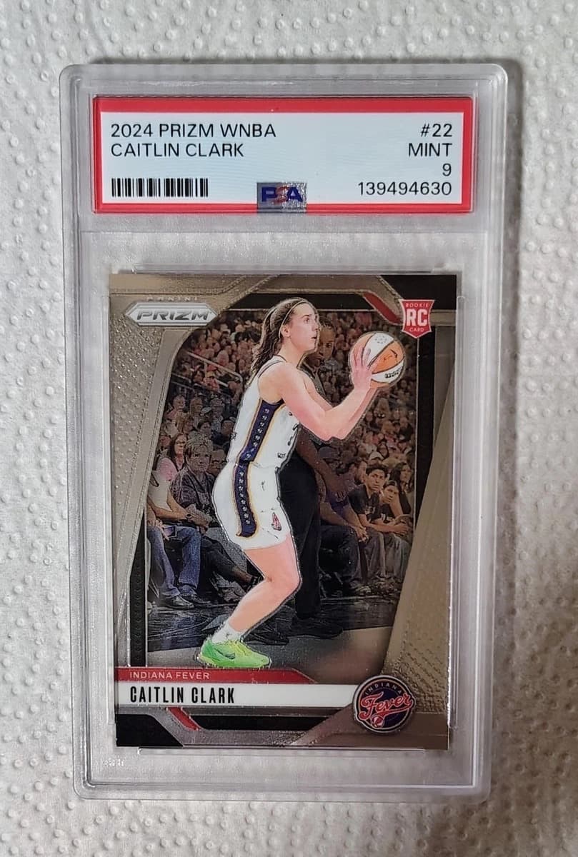 A 2024 Panini Prizm WNBA Caitlin Clark rookie card, number 22, in a PSA 9 slab