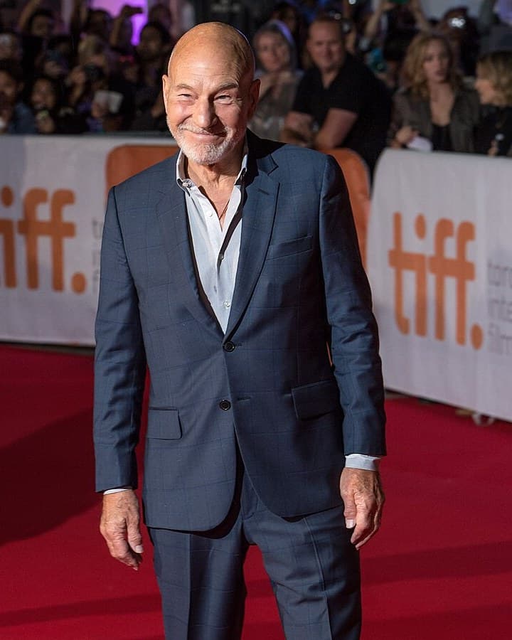 Patrick Stewart in a blue suit on the red carpet at the world premiere of The Martian at the Toronto International Film Festival, Sept. 11, 2015.