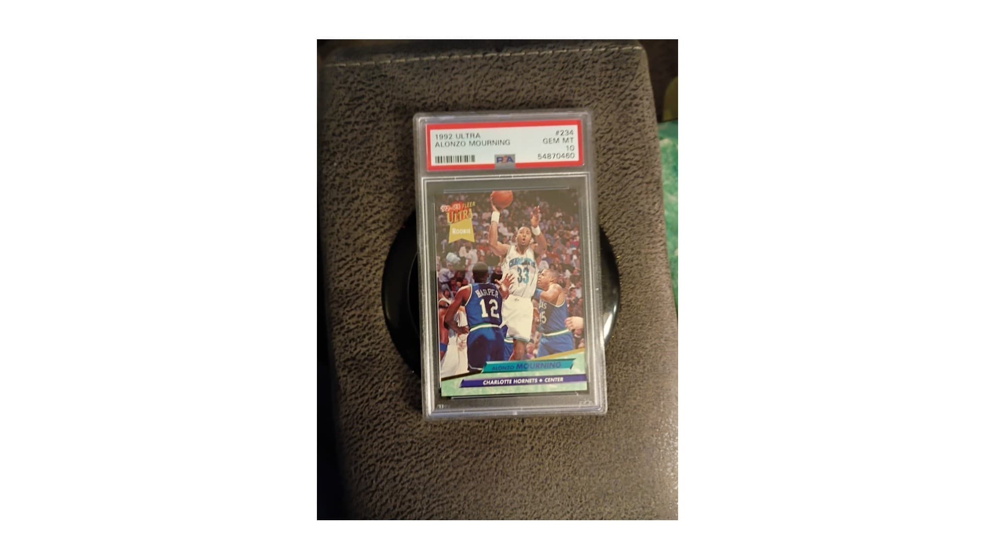 A 1992-93 Fleer Ultra Alonzo Mourning rookie card in a PSA 10 holder