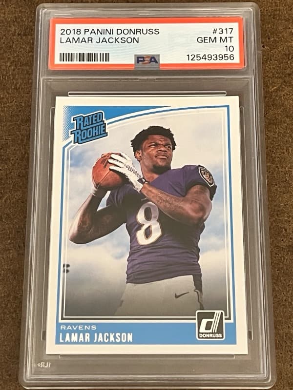 The 2018 Panini Donruss #317 Lamar Jackson Rated Rookie in a PSA 10 slab, cert 125493956. Card image: eBay listing photo.