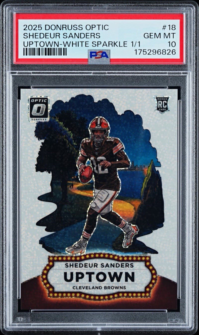 The 2025 Panini Donruss Optic Uptown Shedeur Sanders White Sparkle 1/1, graded PSA 10, with the parallel and serial on the label itself. Card image: eBay listing photo.