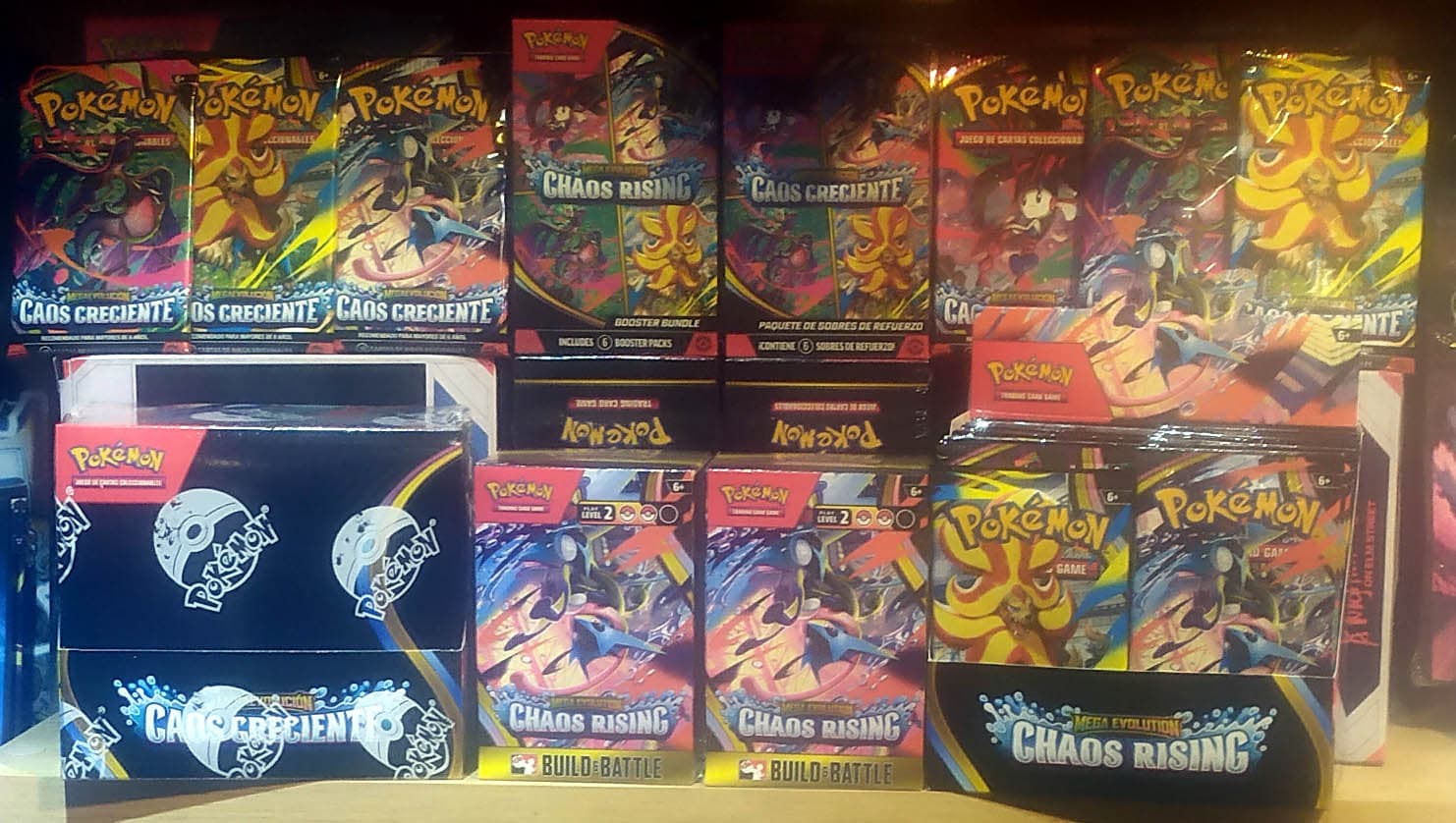 Sealed Pokémon Chaos Rising booster bundles and boxes on a store shelf