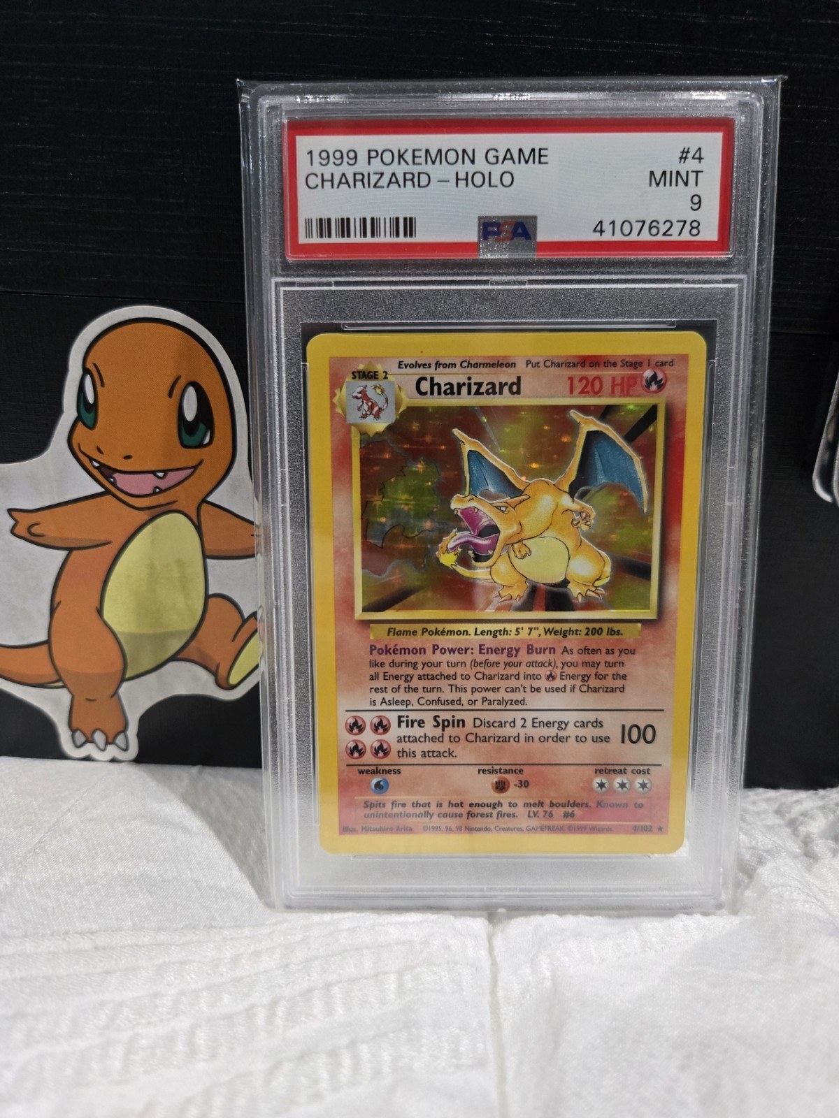 Front of a PSA-graded 1999 Base Set Charizard, 4 of 102, showing the red label and the grade of 9