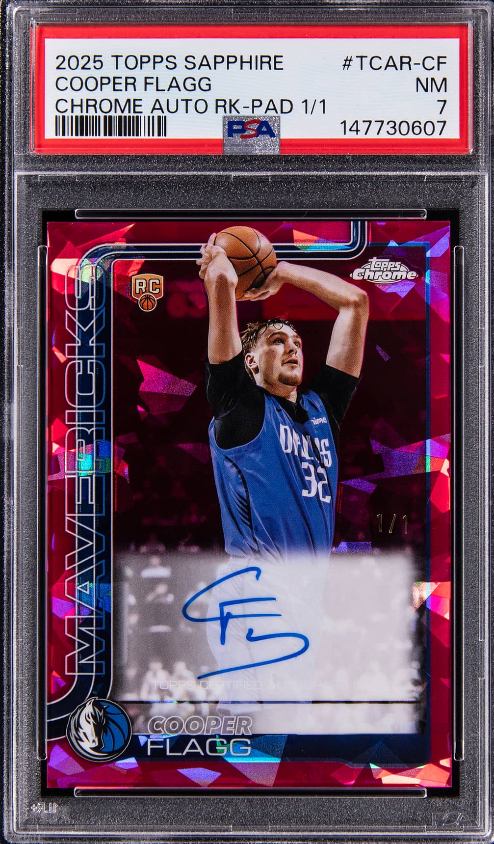 The 2025-26 Topps Chrome Sapphire Padparadscha Cooper Flagg one-of-one rookie autograph in a PSA 7 holder, signed on the card in blue
