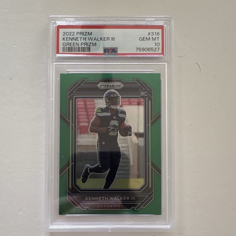 Kenneth Walker III 2022 Panini Prizm #318 Green Prizm rookie, PSA 10. Photo: eBay listing.