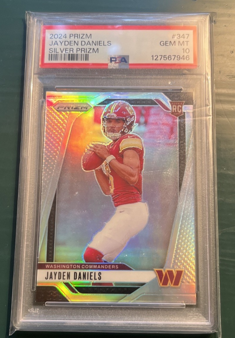 A 2024 Panini Prizm Silver #347 Jayden Daniels rookie in a PSA GEM MT 10 holder, the card the sold comps above track. eBay listing photo, via CardSight.